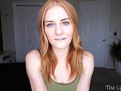 Blue- eyed chick with red hair is posing and teasing topless...